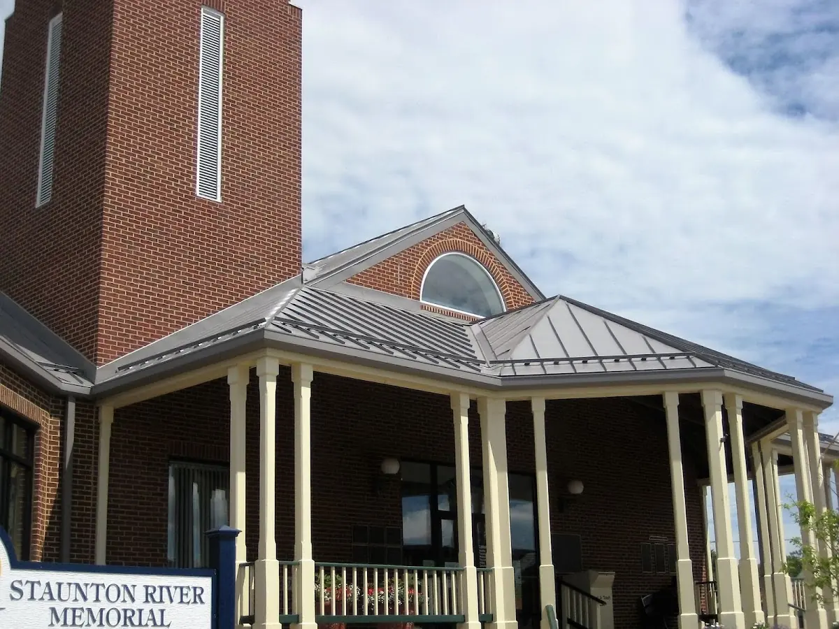 Skilled roofing craftsmen working on a residential roof in Merrimacport